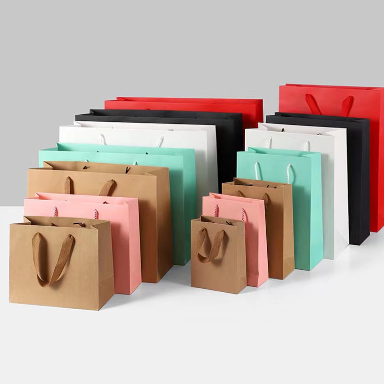 Wholesale Custom Printed Logo Packaging bags Gift Craft Shopping Paper Bag na may Ribbon Handle