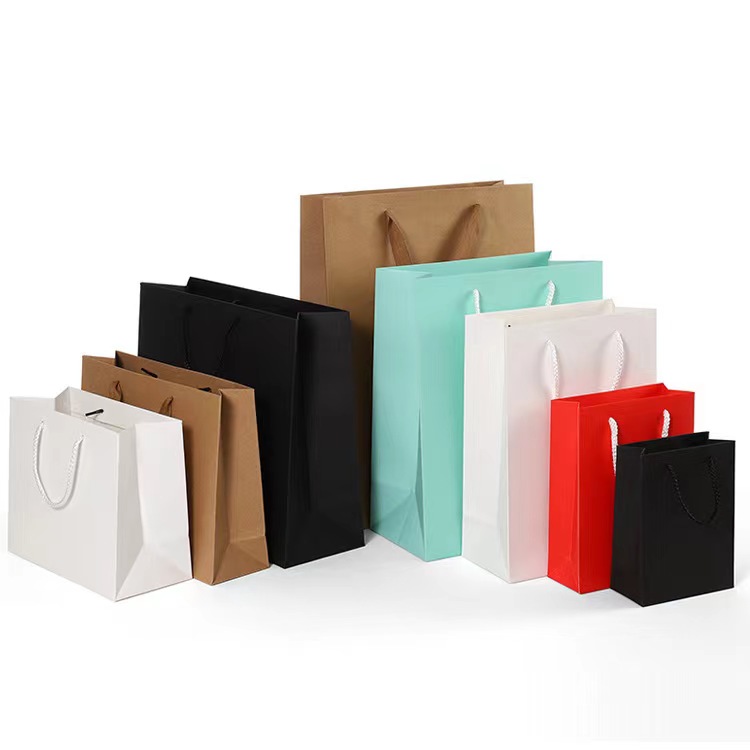 Grosir Custom Printed Logo Packaging tas Gift Craft Shopping Paper Bag Kanthi Ribbon Ngalahake