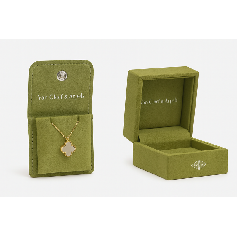 The brand uses light green velvet boxes with ivory ribbons, exuding understated luxury.