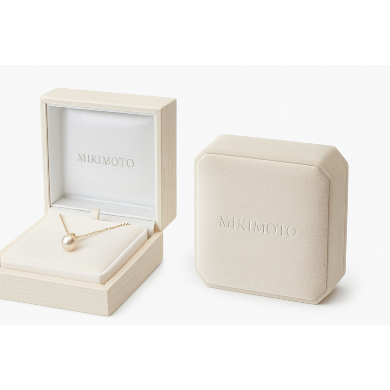 Mikimoto’s packaging reflects its pearl heritage with light gray-white hues and silver typography.