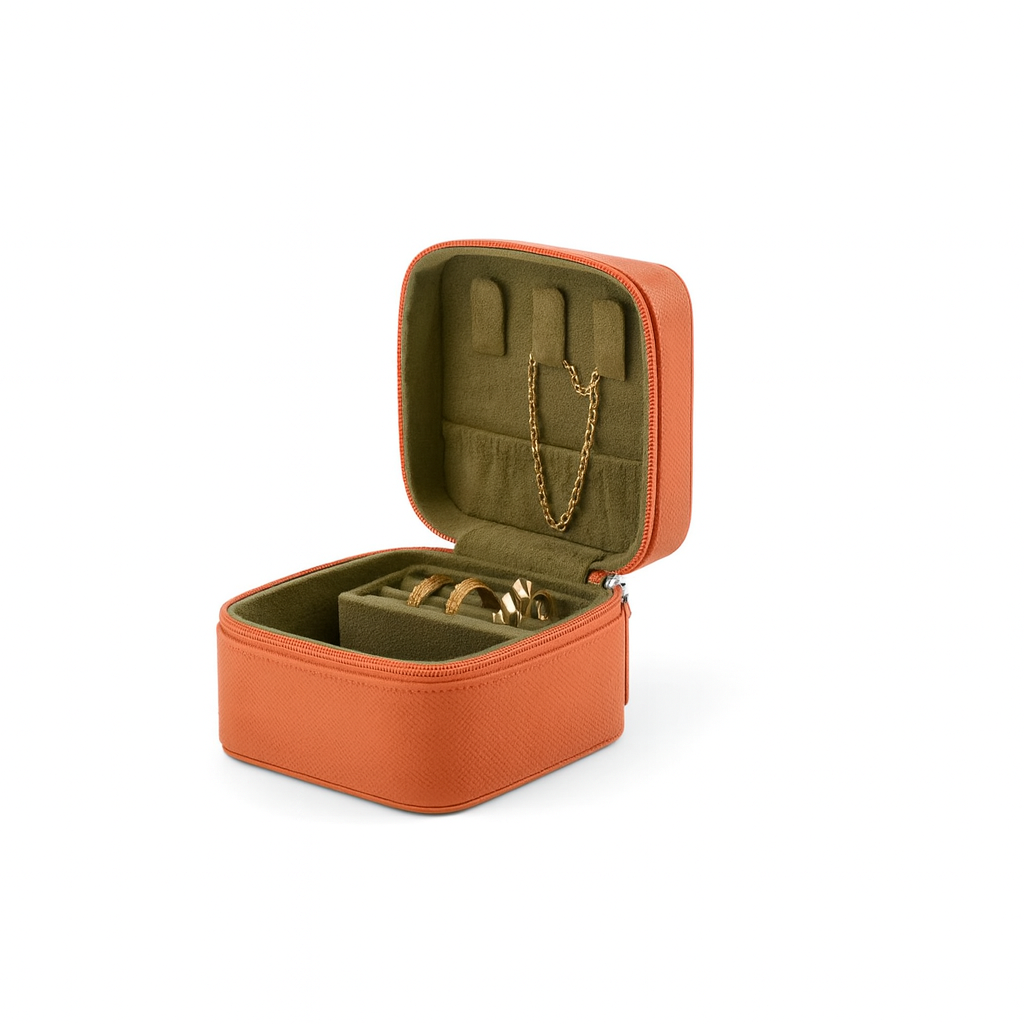 This sturdy cubic leather jewelry box is perfect for short trips—compact, durable, and stylish.