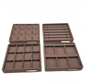 Leather's luxurious texture is also durable and easy to clean, making it ideal for high-end jewelry retail displays.